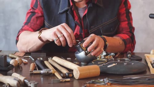 Artisan Jeweler Crafting Jewelry at Workbench