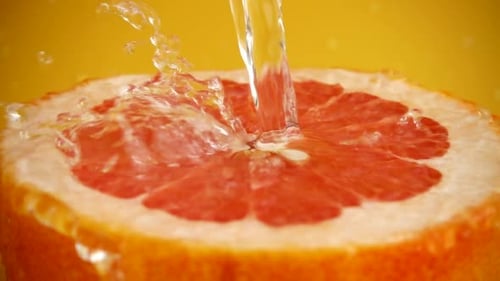 Grapefruit Sliced Open and Poured with Water