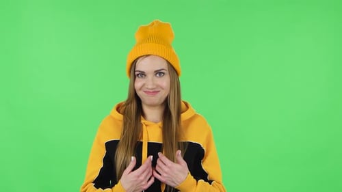 Portrait of Modern Girl in Yellow Hat Is Pointing Herself, Say Who Me No Thanks i Do Not Need. Green