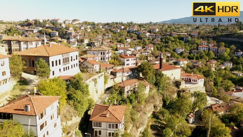 Aerial View of Hillside Village with Orange Rooftops