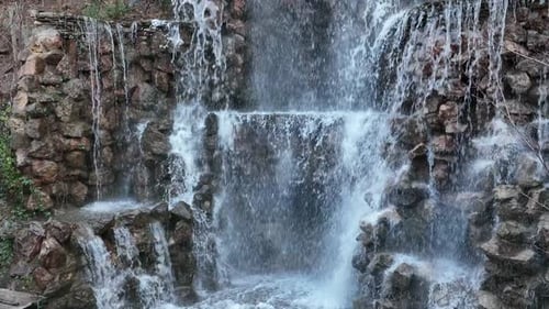 Small Artificial Waterfall Slow Motion Aerial Video