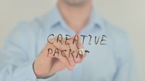 Writing Creative Package on Clear Surface
