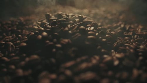 Pouring Steaming Roasted Coffee Beans Close Up