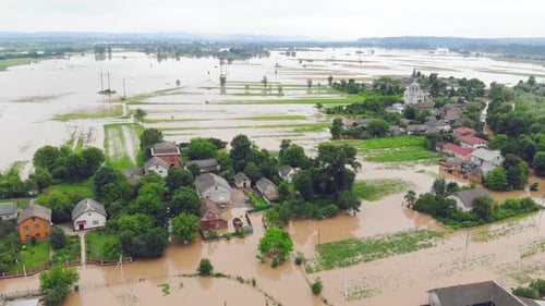 Aerial View Floods and Flooded Houses. Mass Natural Disasters and Destruction. A Big City Is Flooded