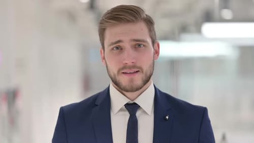 Serious Man in Suit Looking at Camera