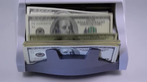 Counting Dollars With a Currency Counter Machine