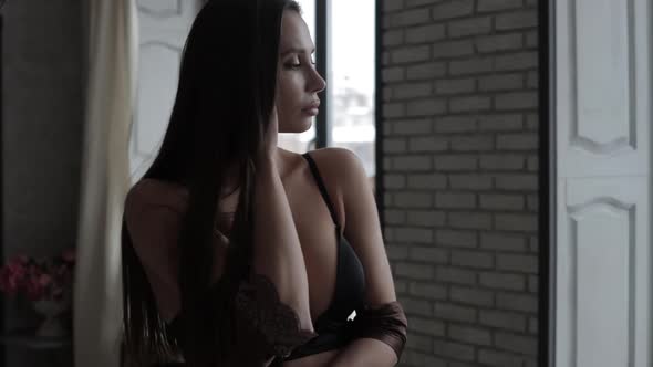 Sensual Woman Posing in Lingerie in Bedroom Sensual Woman Posing in Lingerie in Bedroom