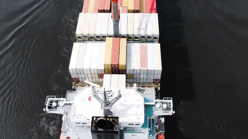 Pictorial Loaded Freight Vessel Sails on Deep Ocean Water