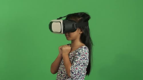 Girl Experiencing Virtual Reality on Green Screen