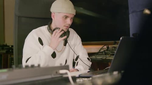 Young Caucasian Man Working at Music Recording Studio