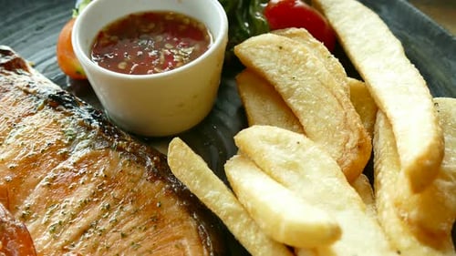 Macro Shot of Fresh Salmon and French Fries