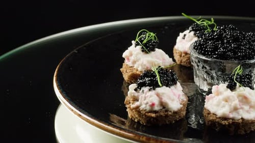 Black Caviar Appetizers Displayed in Elegant Setting
