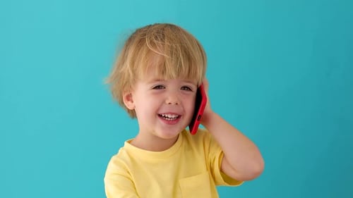 Young Blond Child Talking on Mobile Phone