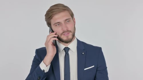 Smiling Adult Talking on Phone in Blue Suit
