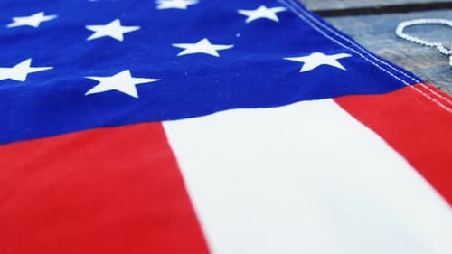 American Flag and Military Dog Tags on Wood