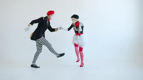 Mime Couple Dancing in a White Studio