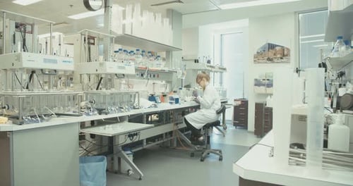 Scientist working in a bright Laboratory