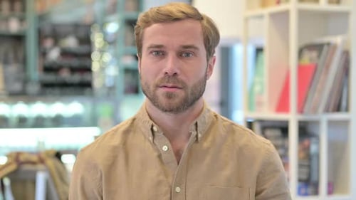 Man Raises Index Finger in Disagreement