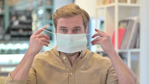 Close Up of Young Man Wearing Face Mask
