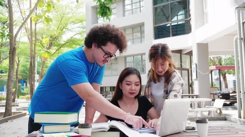Multiracial college university students group study together. brainstorm and discuss in university