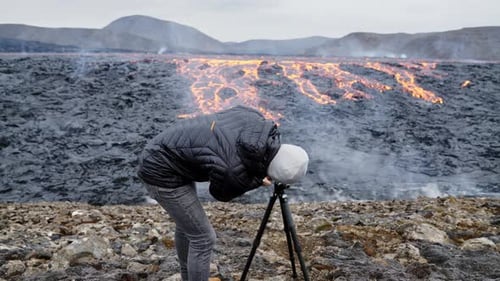 Photographer Shooting Volcanic Lava Flow in Iceland