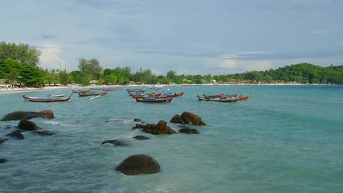 White Sandy Beach and Boats in Sea