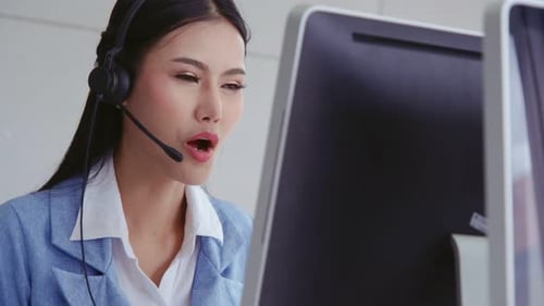 Customer Support Agent or Call Center with Headset Talking to Customer on Phone