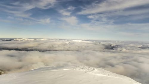 Peaks of Mountains above the Clouds