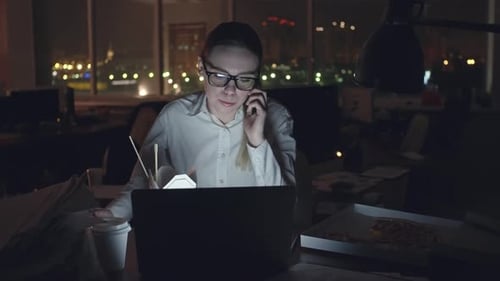 Businesswoman Spending Night at Office