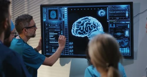 Medical Team Analyzing Brain Scan in Office