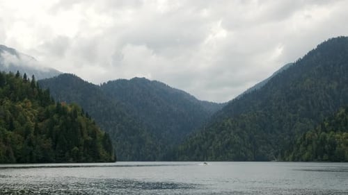 Aerial Shot of Beautiful Alpine Lake Ritsa Speed Boat Floating Summer, View From Above on Gorgeous