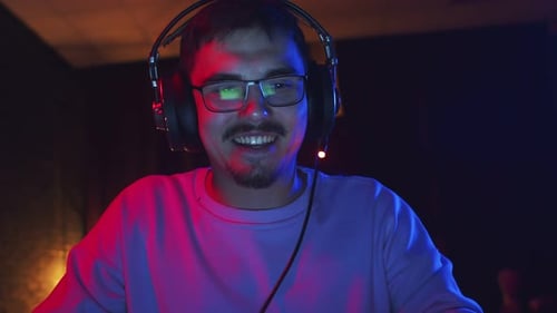 Close Up Of Man With Headphones Talking