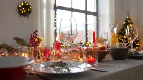 Christmas Table Setting with Candles and Decorations