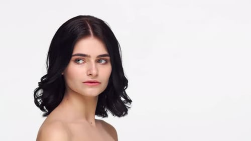 Studio portrait of young and beautiful brunette woman.