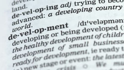 Dictionary Page Defining Development Word