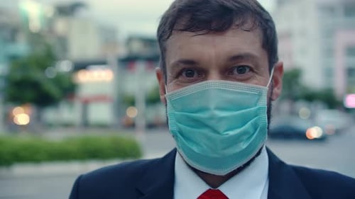 Man in Suit Wearing Face Mask in City