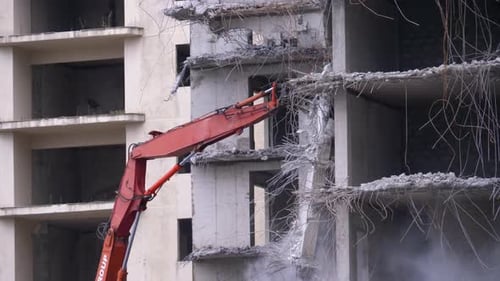 Building Demolition with Heavy Machinery in Urban Setting