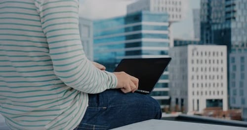 Hipster Man Work on Laptop in Business District