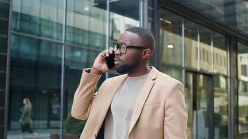 Man Talking on Cell Phone in Urban Setting