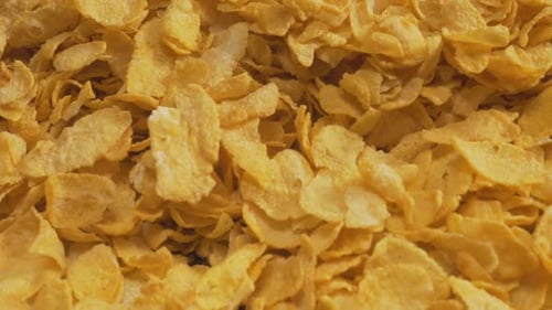 Crisp Golden Cornflakes Panning Close Up