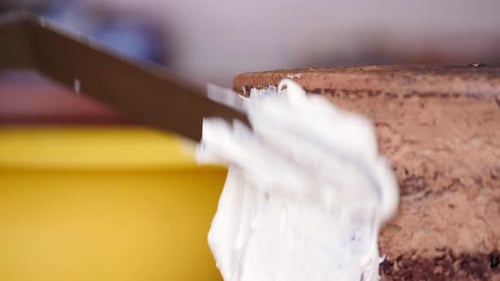 Close up of a cake with whipped cream frosting