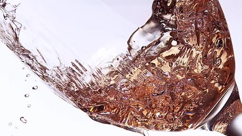 Bronze Liquid Swirling in a Glass Close Up