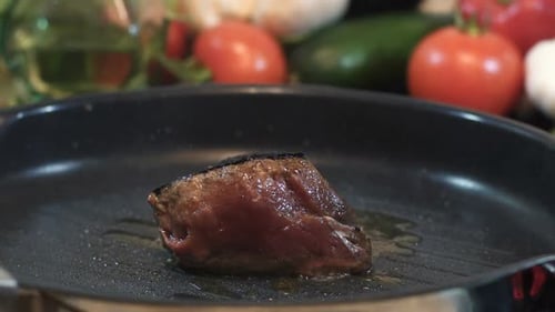 Close Up of Steak on a Grill Pan