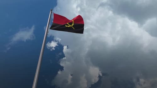 Angolan Flag Waving Realistically in Blue Sky Loop