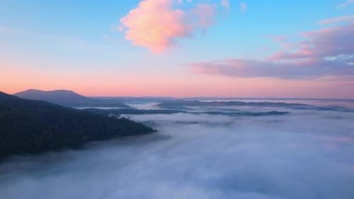 4K Aerial view of Mountains landscape with morning fog.