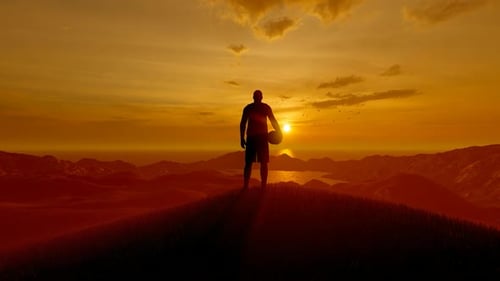 Basketball Player Peaking At Sunset With His Ball