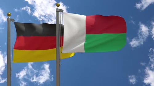 Flags of Germany and Madagascar Waving in the Sky