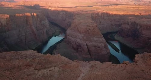 Rocky cliff edge above Horseshoe bend,sunrise,Colorado river,Arizona