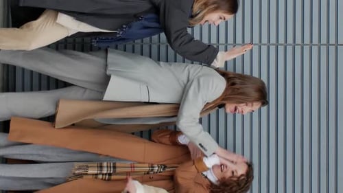 Enthusiastic Young Adults Performing Coordinated Movements in Urban Setting