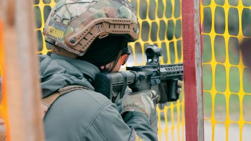 Military Shoots with a Machine Gun Close Up